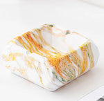 Cendrier design en marbre blanc orange